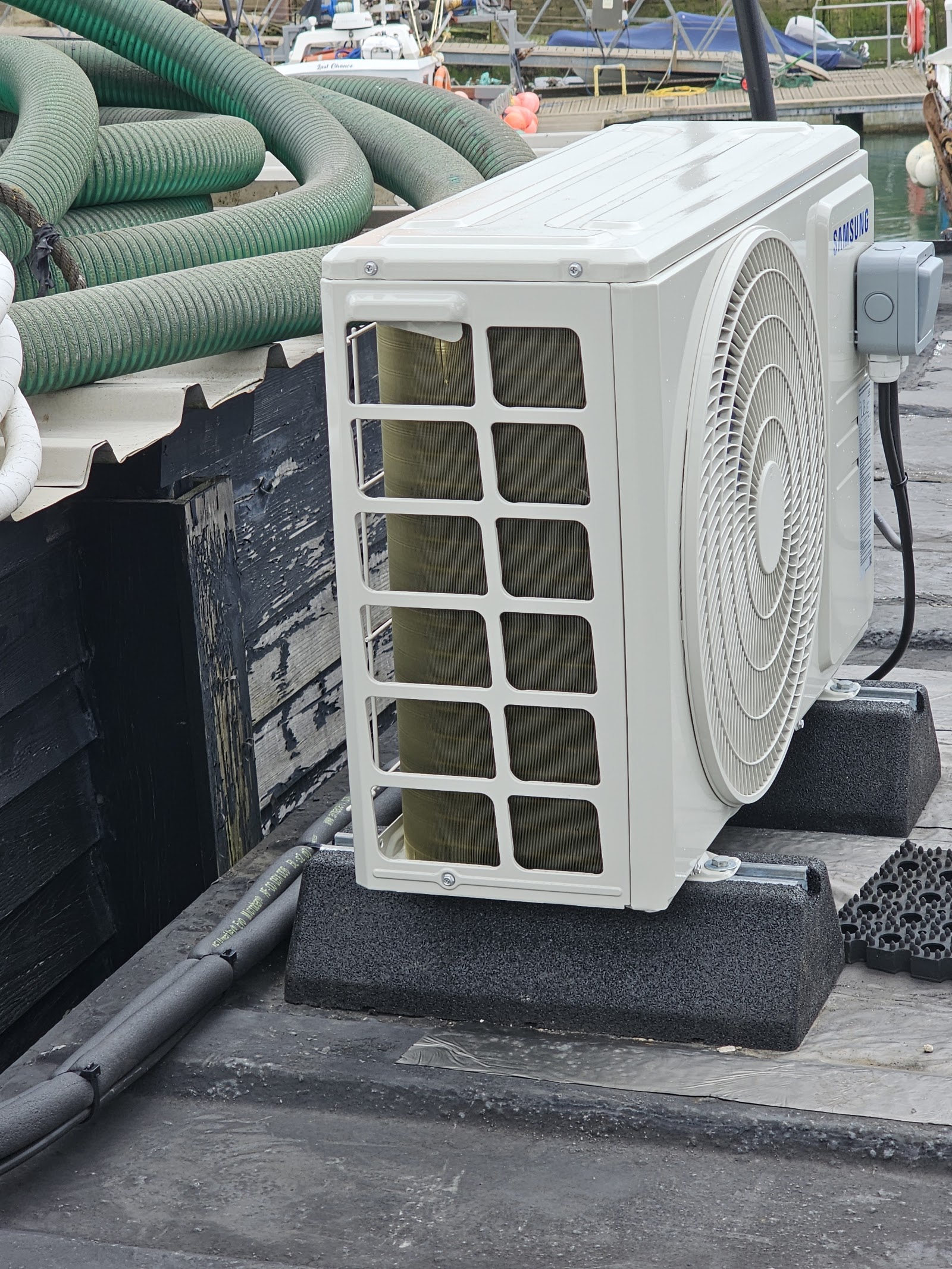 Waterside AC condenser supply and isolation — power provided and coordinated around the installer's schedule.